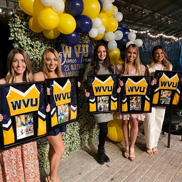 Claire Frank, first on left, and her WVU Dance teammates won a national title in 2021.