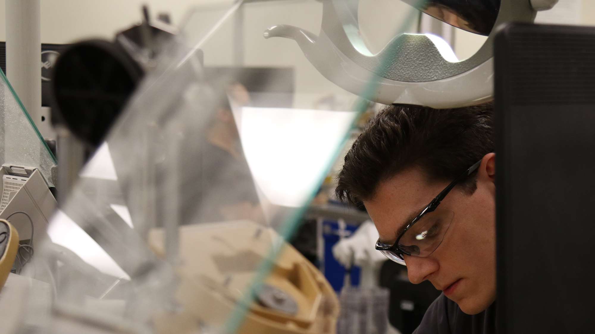 A student works in a dental school simulation lab.