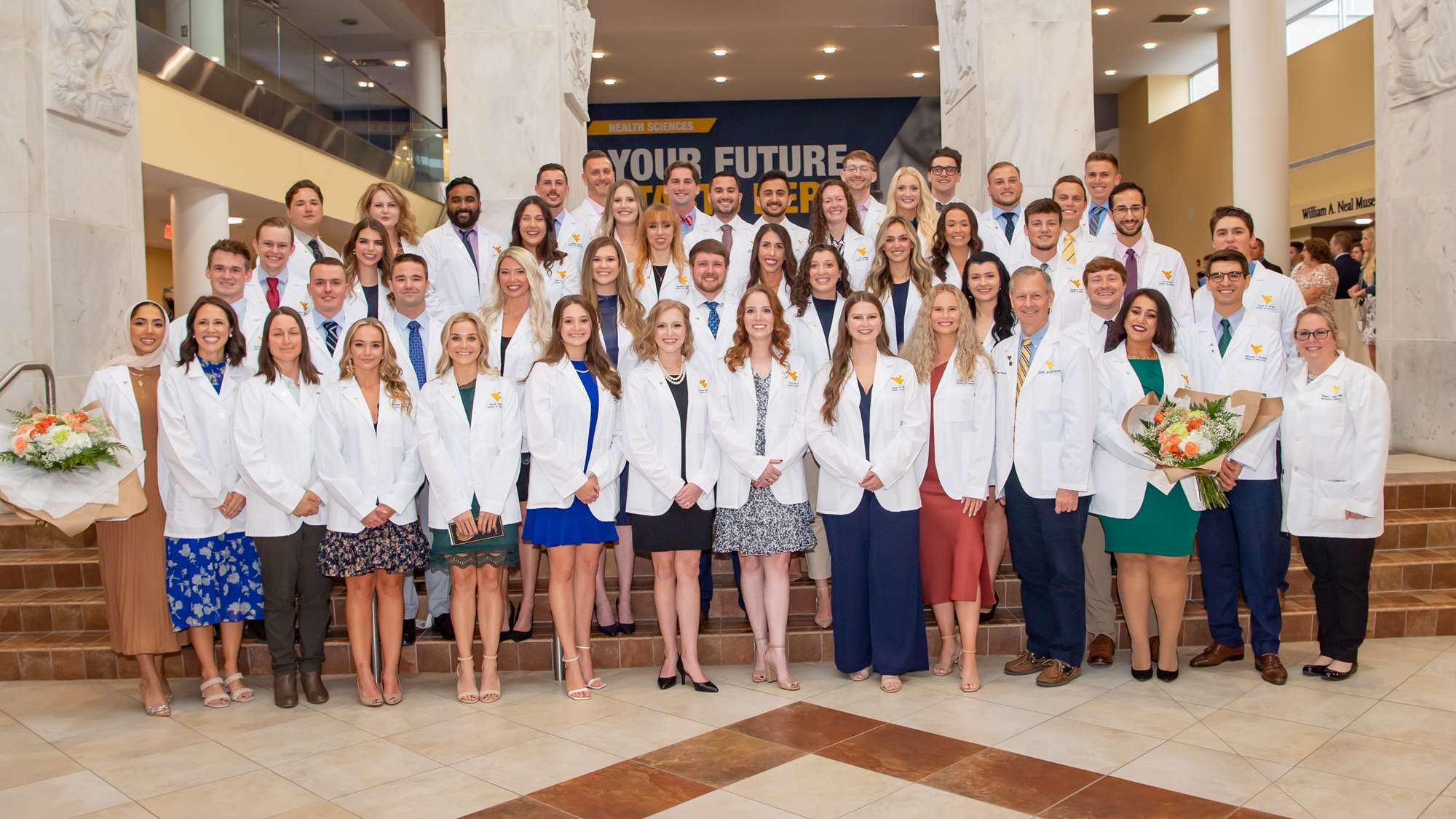 Prior to beginning direct patient care, students receive white coats and commit to a pledge of professionalism.