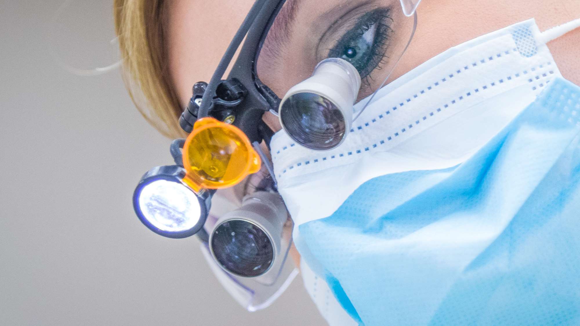 A dental school student makes an observation in the clinic. 