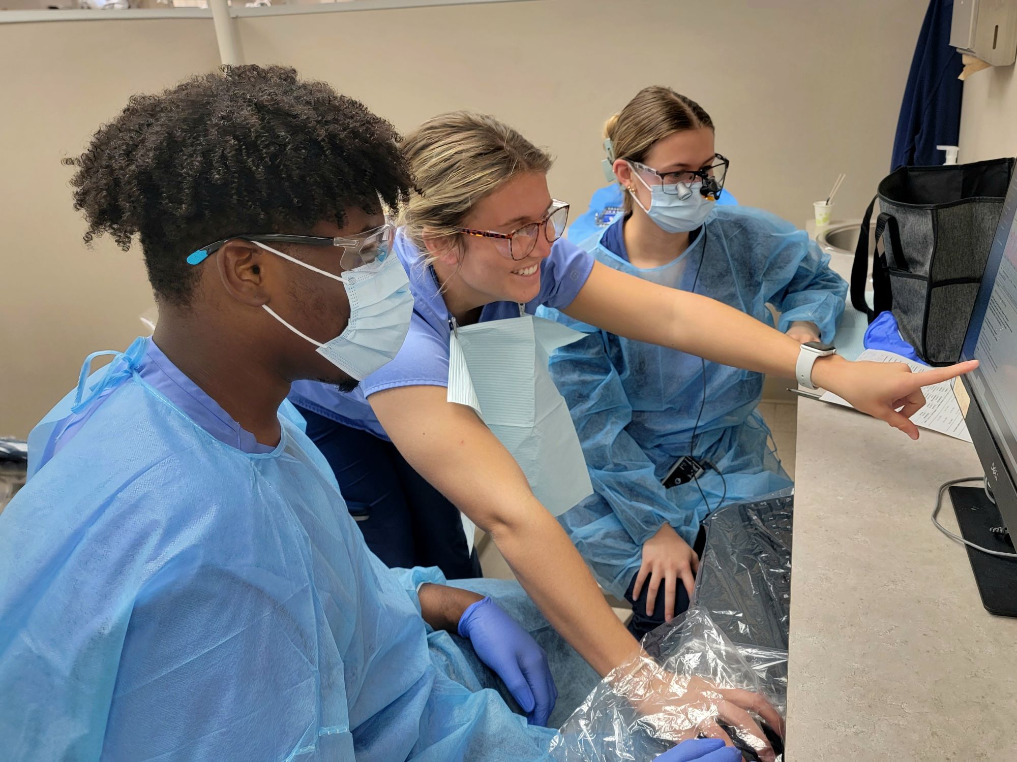 Dental hygiene students work together in the clinic.