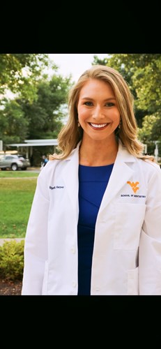 Ellyn Harper poses in her white coat.